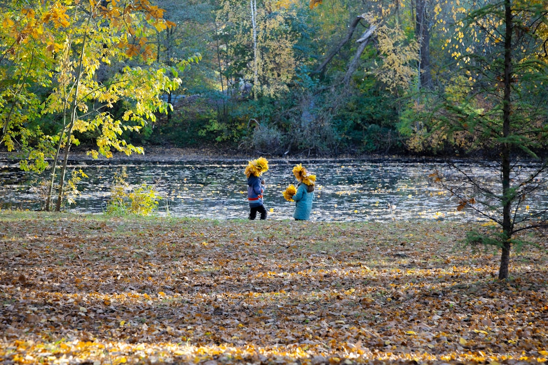 Children playing and exploring in outdoor nature setting