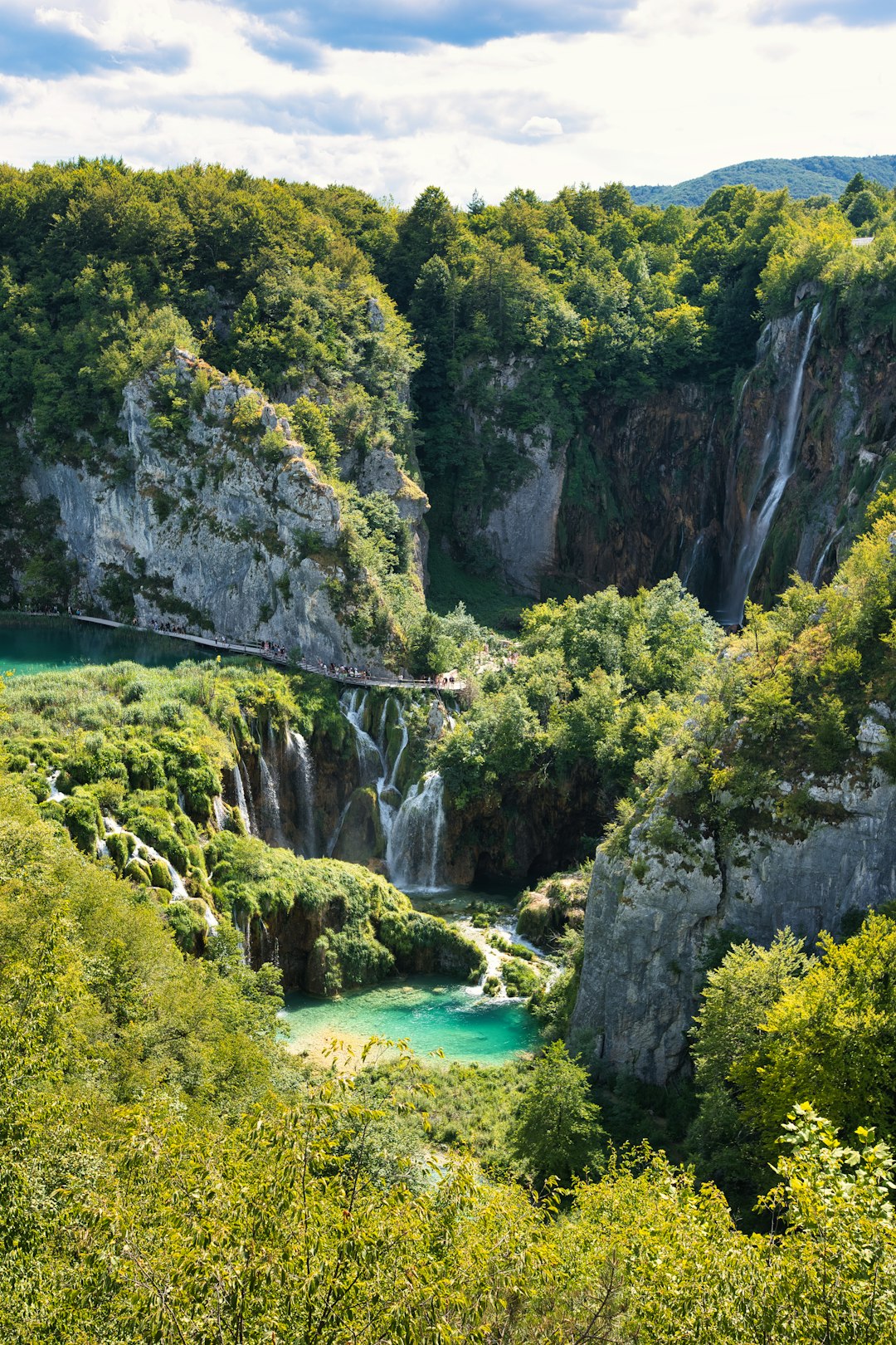 Path alongside turquoise lake at Plitvice Lakes