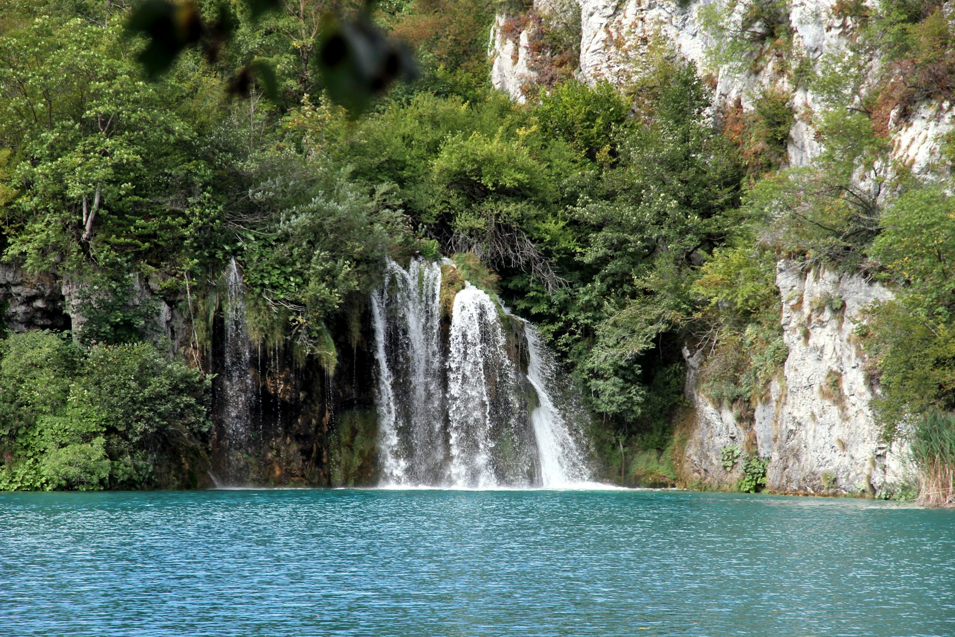 Waterfall between upper lakes of Plitvice Lakes National Park in summer