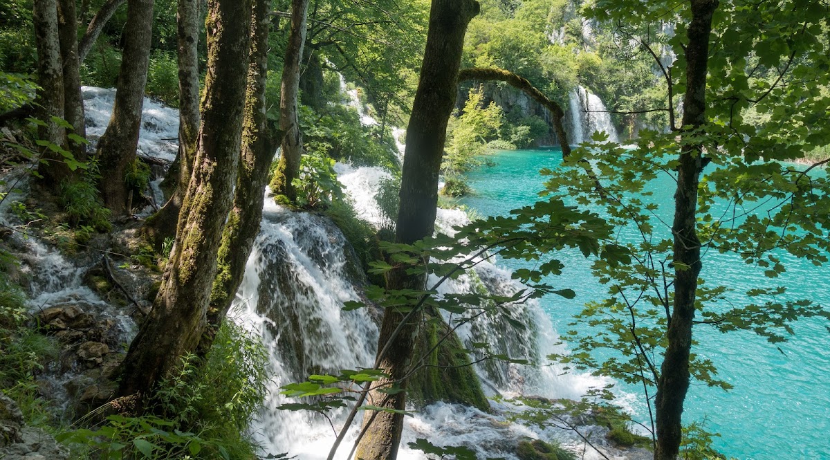 Frozen waterfall covered in ice and snow during winter