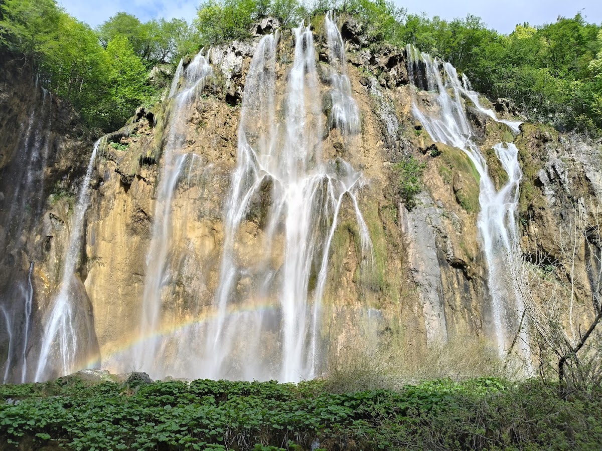 Great waterfall cascading down dramatic rock cliff